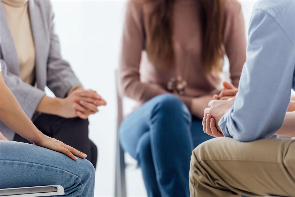 Parents gather in a circle for a discussion